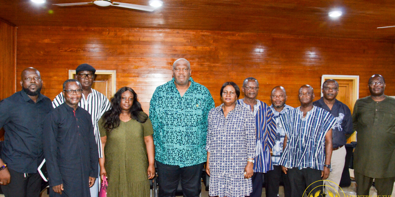 Henry Quartey consoles the Woyongo family